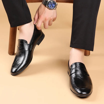 Comfortable men's brown leather slip-on dress shoes, essential for a classic professional style.