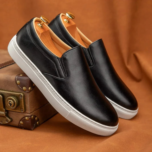 Classic black men's slip-on loafers for versatile dress or casual wear. Comfortable everyday men's footwear fashion.