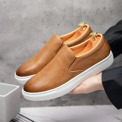 Black men's classic slip-on loafers, a timeless and comfortable footwear option for any casual or dress outfit.