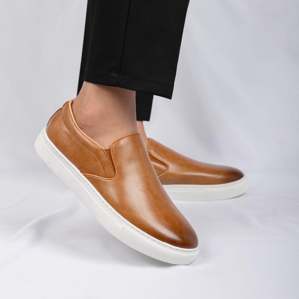 Full view of men's classic slip-on loafers, showcasing versatile and comfortable design for everyday fashion.