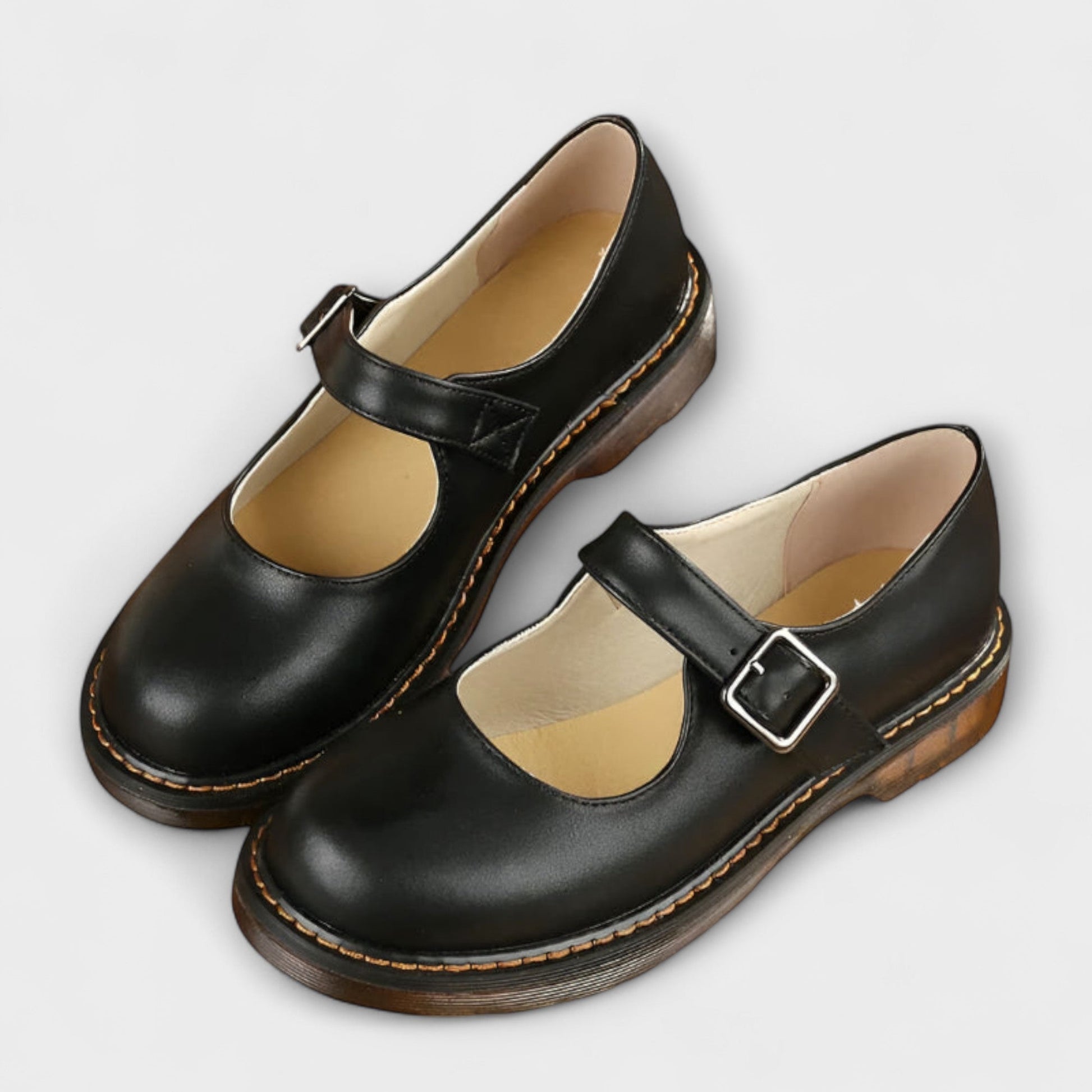 Stylish ladies' Mary Jane flats featuring an adjustable buckle strap for a casual, classic look.