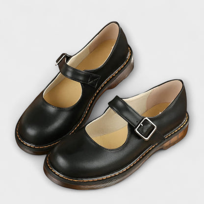 Stylish ladies' Mary Jane flats featuring an adjustable buckle strap for a casual, classic look.