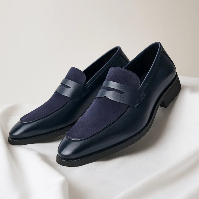 Stylish men's blue classic penny loafers, comfortable slip-on shoes for casual & smart formal outfits.