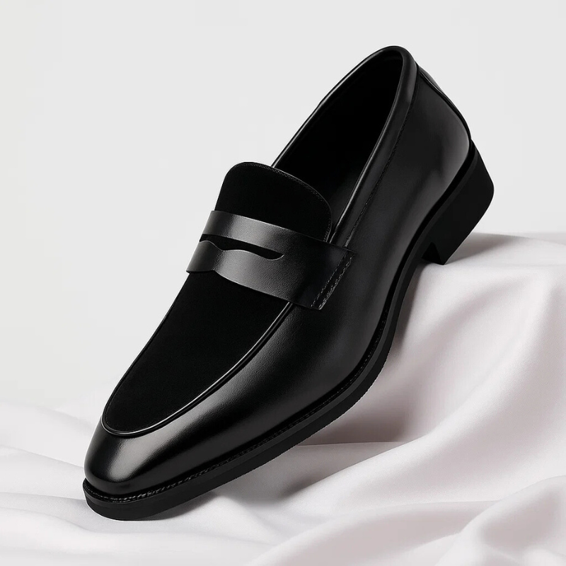 Men's slip-on loafers: black leather penny style, offering classic comfort for formal or casual outfits.