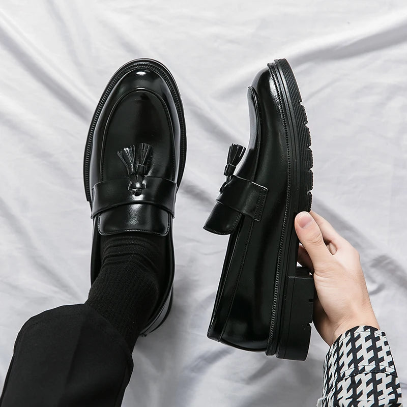 Classic men's black leather slip-on loafers, perfect for formal wear & smart casual outfits.