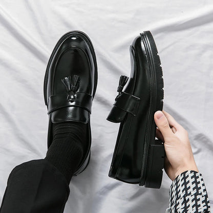 Classic men's black leather slip-on loafers, perfect for formal wear & smart casual outfits.
