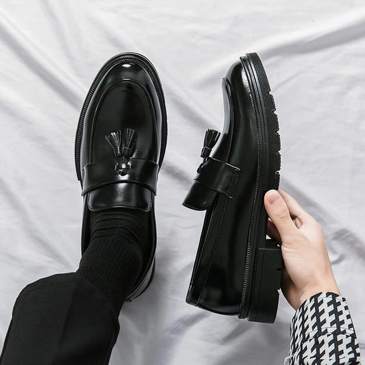 Classic men's black leather slip-on loafers, perfect for formal wear & smart casual outfits.