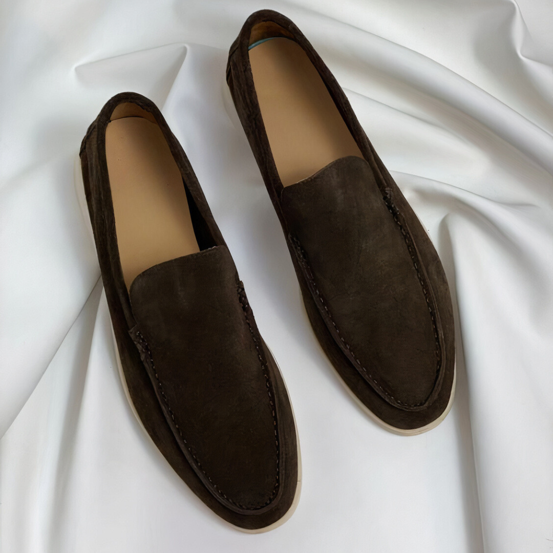 Comfortable black slip-on loafers for men, versatile footwear for office, everyday, and dress occasions.