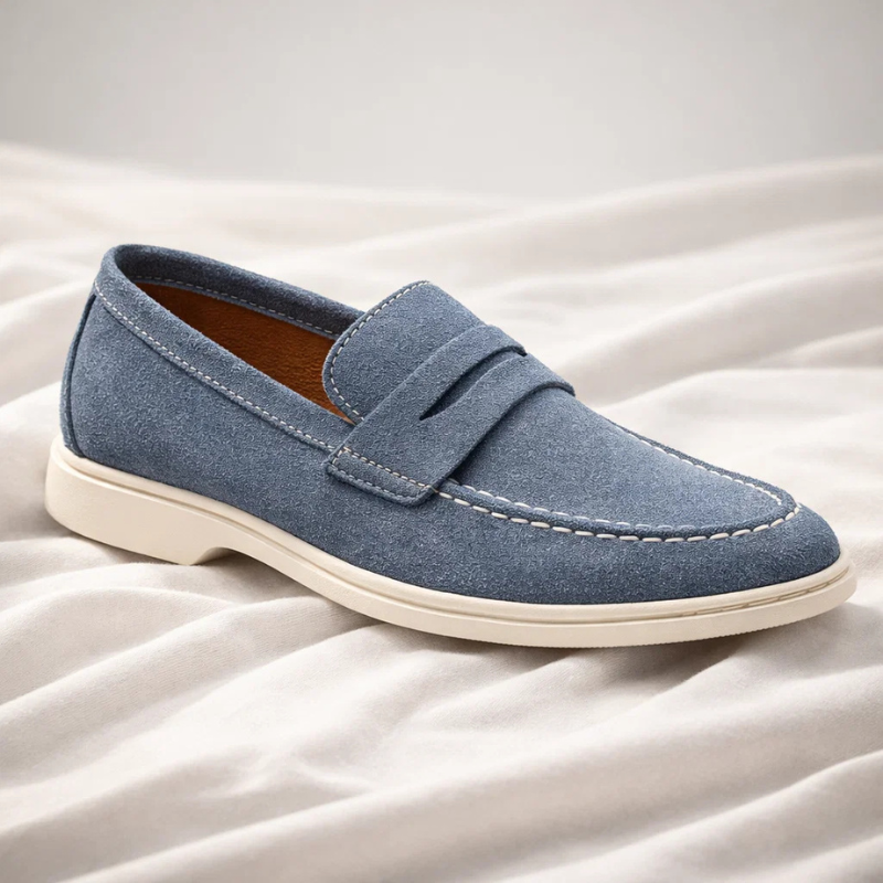 Classic men's blue penny loafers, perfect for casual or dressy everyday style. Comfortable slip-on footwear.