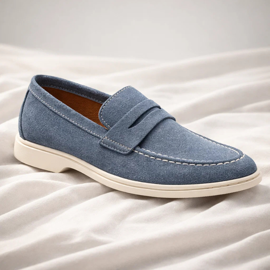 Classic men's blue penny loafers, perfect for casual or dressy everyday style. Comfortable slip-on footwear.