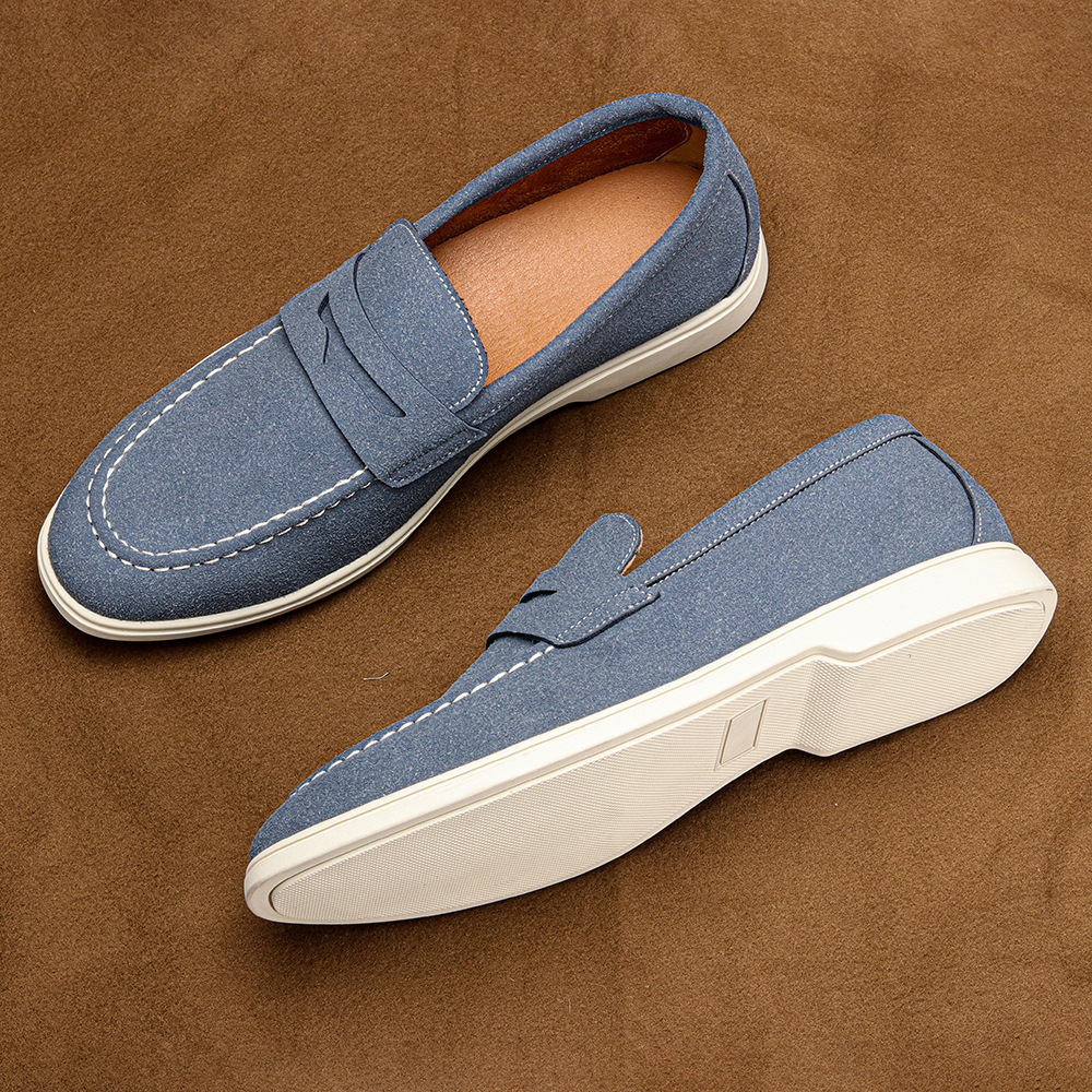 Elegant brown leather men's penny loafers. Stylish, comfortable slip-on shoes for casual and formal wear.