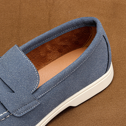 Pair of classic men's penny loafers. Versatile slip-on dress shoes and casual footwear for men.