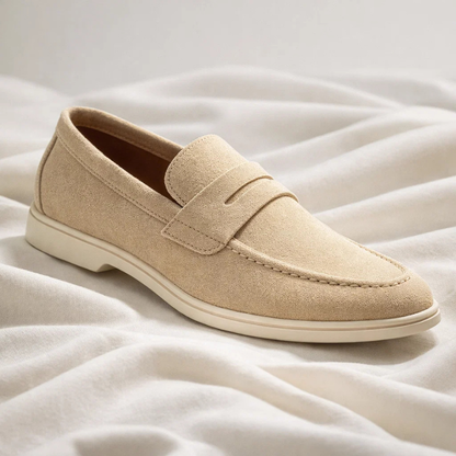 Stylish men's blue penny loafers, offering comfort and sophistication for everyday outfits. Slip-on footwear.