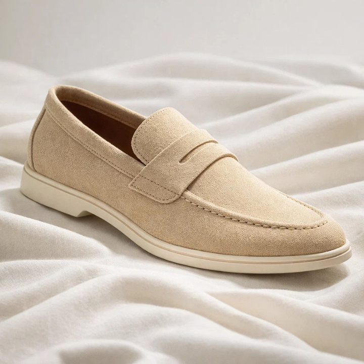 Stylish men's blue penny loafers, offering comfort and sophistication for everyday outfits. Slip-on footwear.
