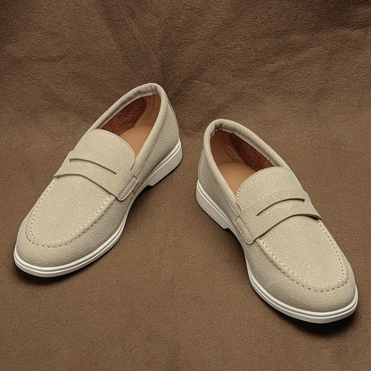 Comfortable brown penny loafers for men, classic design suitable for both casual and dress shoe needs.