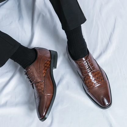 Men's dress shoes: Classic brogue style with elegant detailing. Comfortable formal lace-up oxford.
