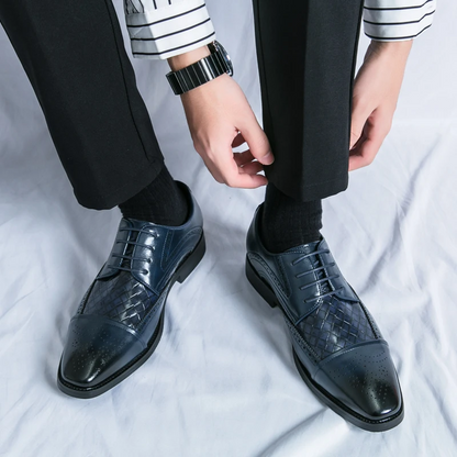 Formal men's brogue shoes. Classic lace-up oxford style with elegant detailing for comfort.