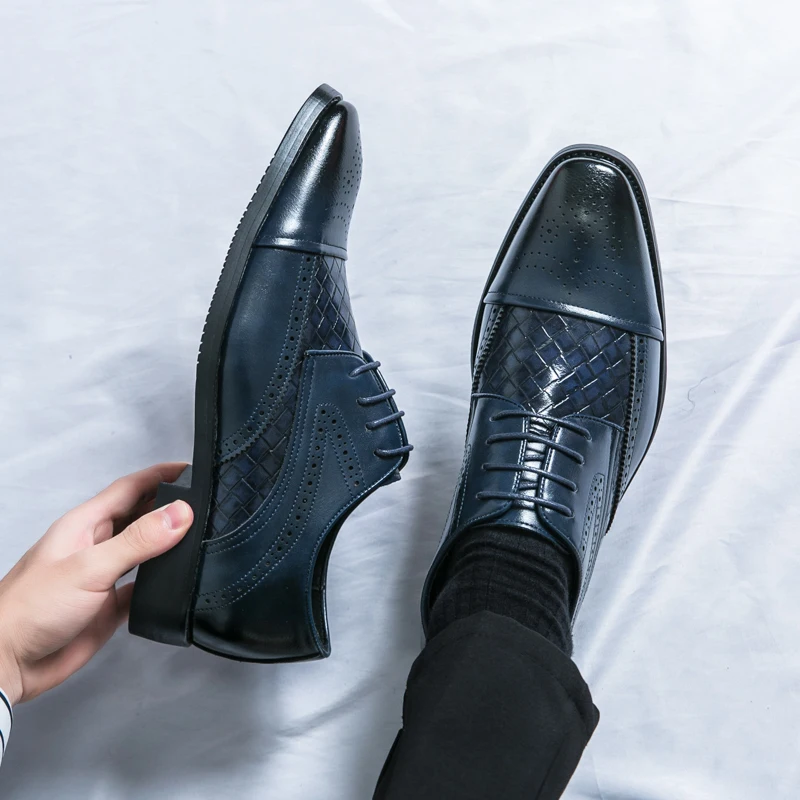 Men's classic brogue dress shoes, sleek design with elegant detailing. Comfortable formal footwear.