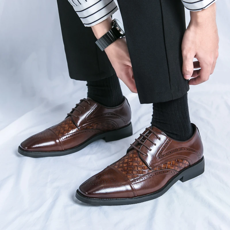 Stylish men's brogue dress shoes. Elegant detailing, classic lace-up oxford design for formal events.