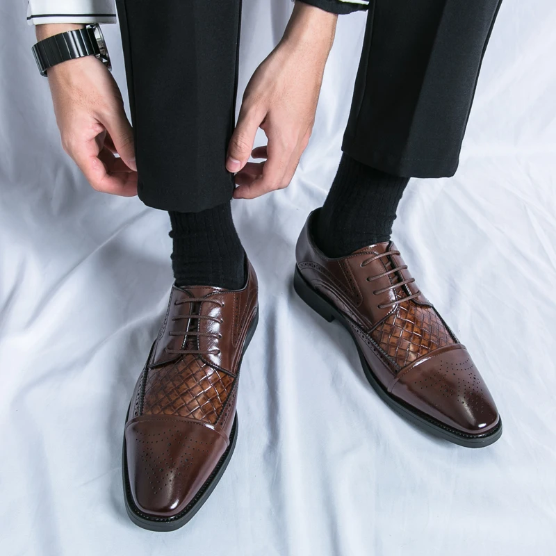 High-quality men's brogue dress shoes with elegant detailing. Classic lace-up formal oxford.