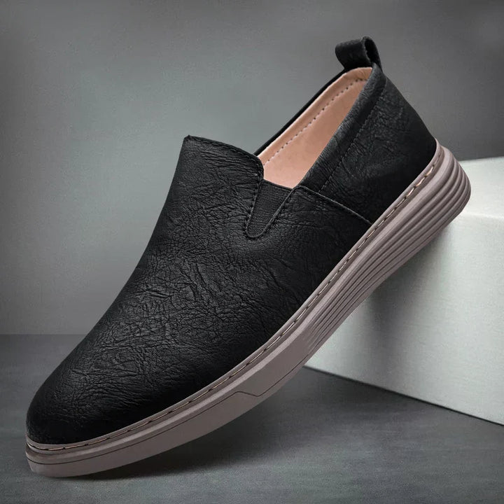 Elegant men's slip-on dress loafers in a classic style. Versatile footwear for formal occasions or daily wear.