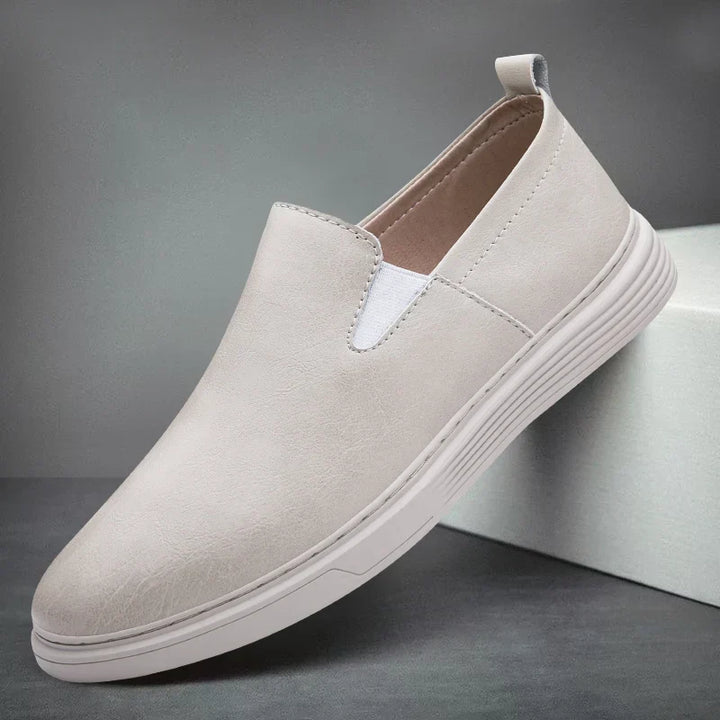 Beige men's slip-on casual loafers. Comfortable and stylish footwear, perfect for a relaxed yet polished look.