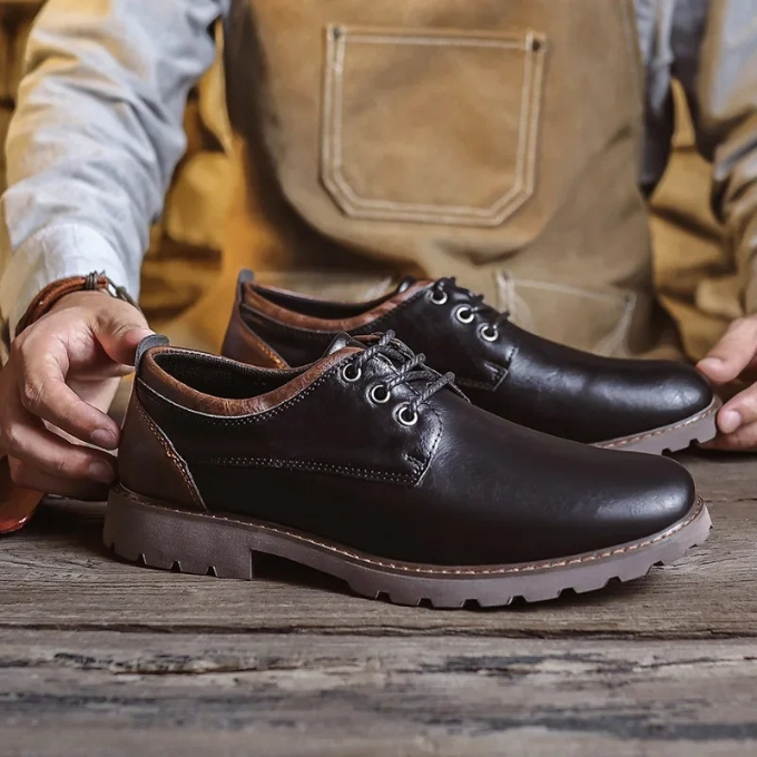 Back view of durable Men's Cedar Ridge dress shoes, offering classic style.
