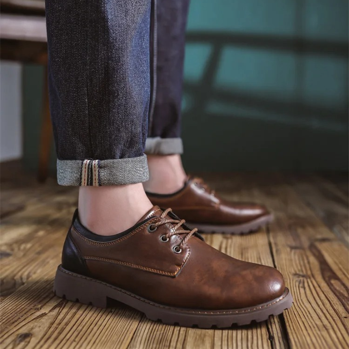 Close-up of the rich leather texture on Men's Cedar Ridge classic oxford shoes.