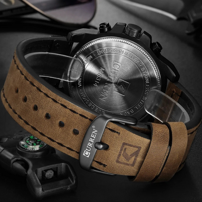 Classic men's chronograph watch, sleek design, durable leather band & stainless steel finish. Water resistant.
