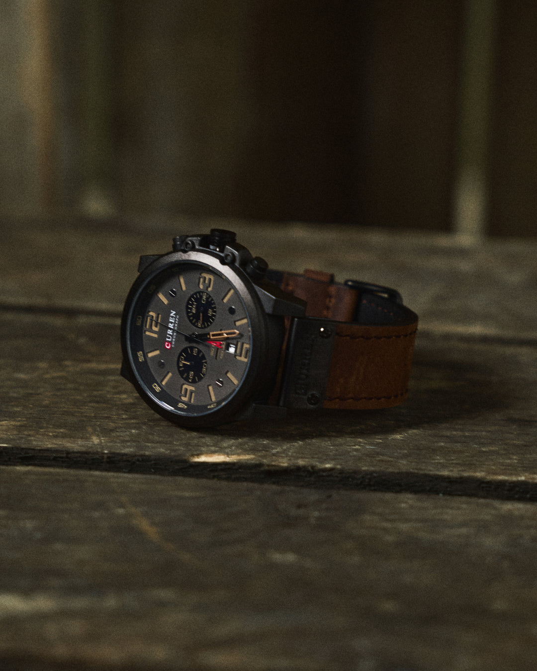 Water-resistant men's chronograph timepiece. Durable stainless steel case, genuine leather strap.