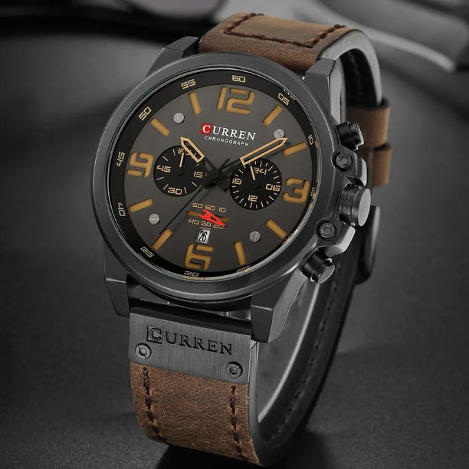 Side view: Men's chronograph watch, highlighting stainless steel case, genuine leather band texture.