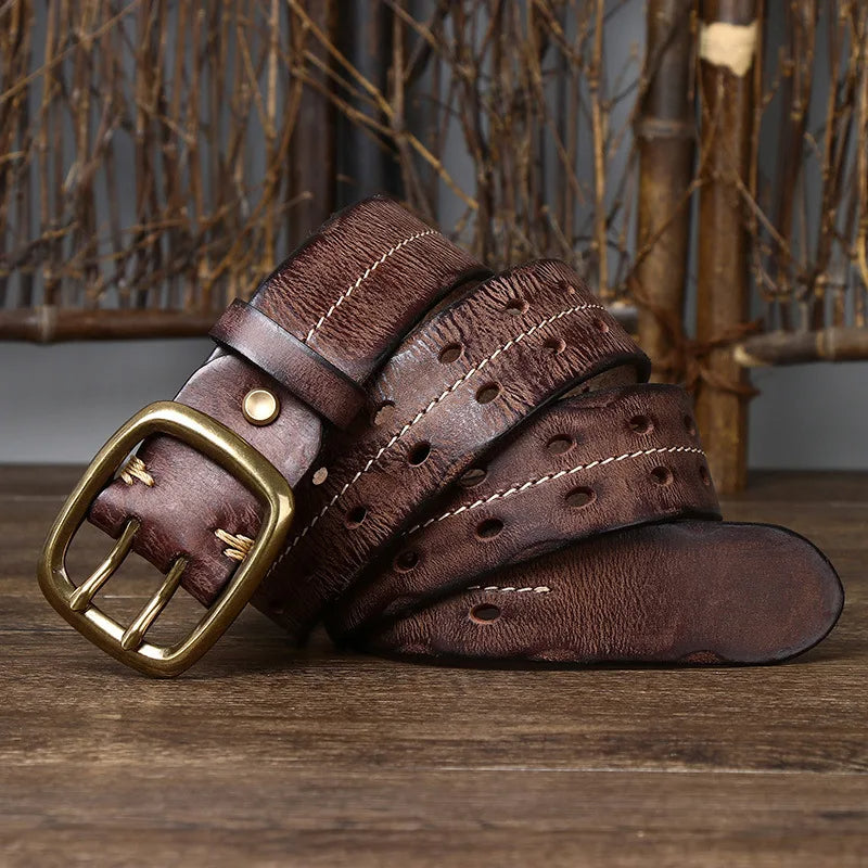 Close-up of the rich texture of a men's full-grain brown leather belt, highlighting craftsmanship.