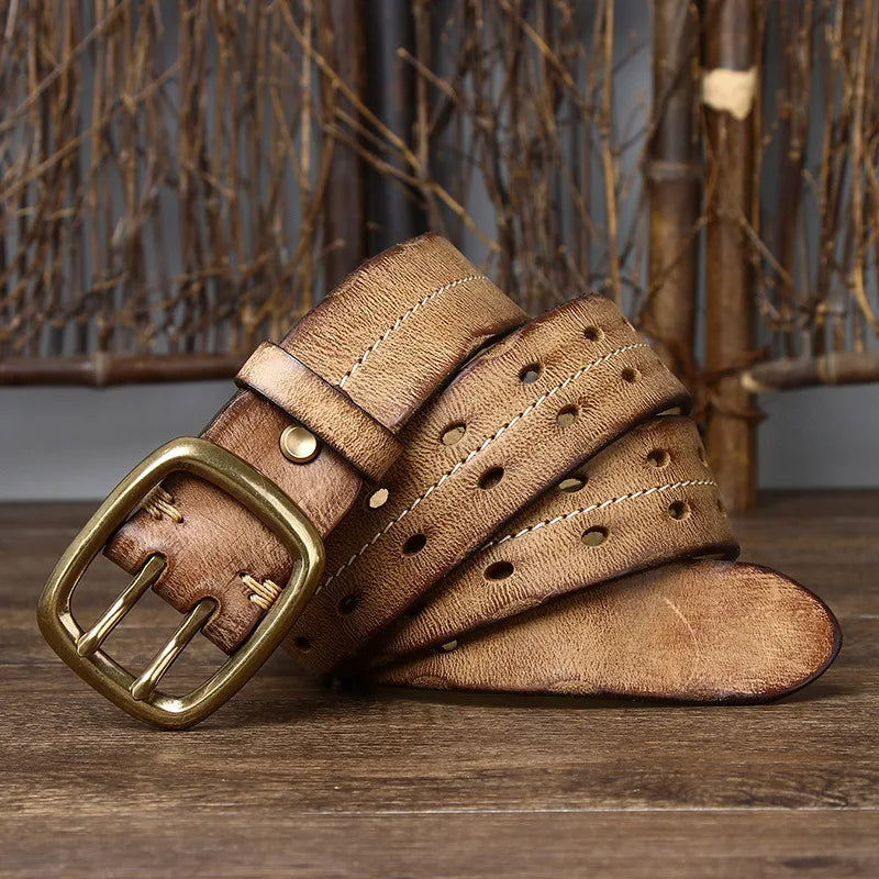 Polished brass buckle on a classic men's full-grain leather belt, showcasing quality and design.