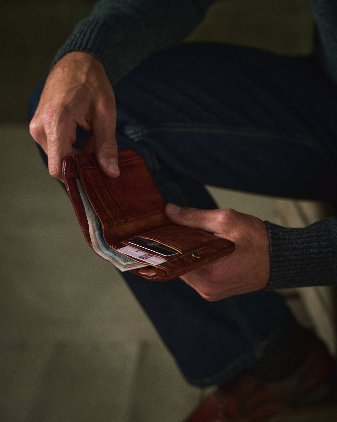 Rich brown full-grain leather bifold wallet for men, offering classic style and durability.