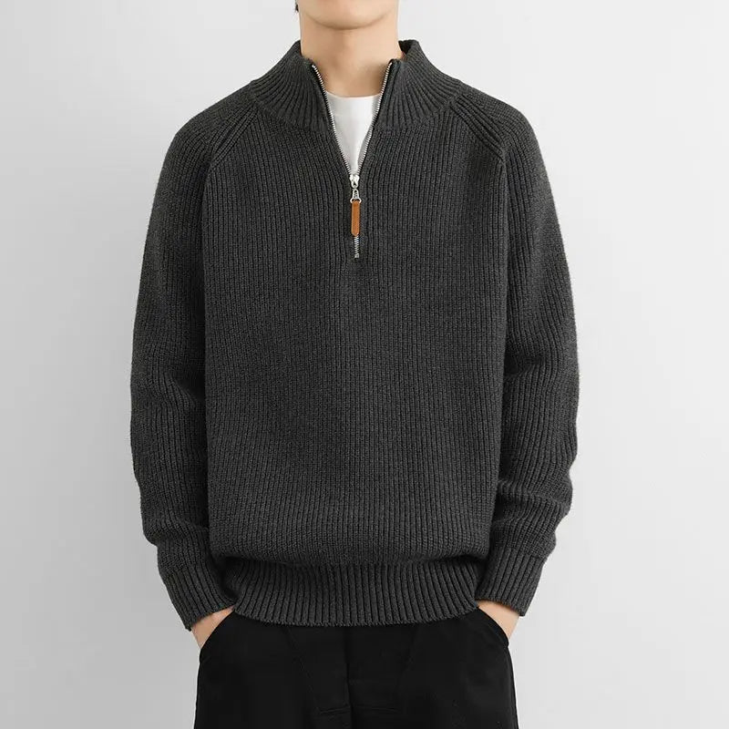 Close-up of the heritage knit texture on a men's classic half-zip sweater, showing quality and detail.