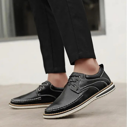 Textured leather men's black moc toe oxfords, delivering sophisticated and elegant style.