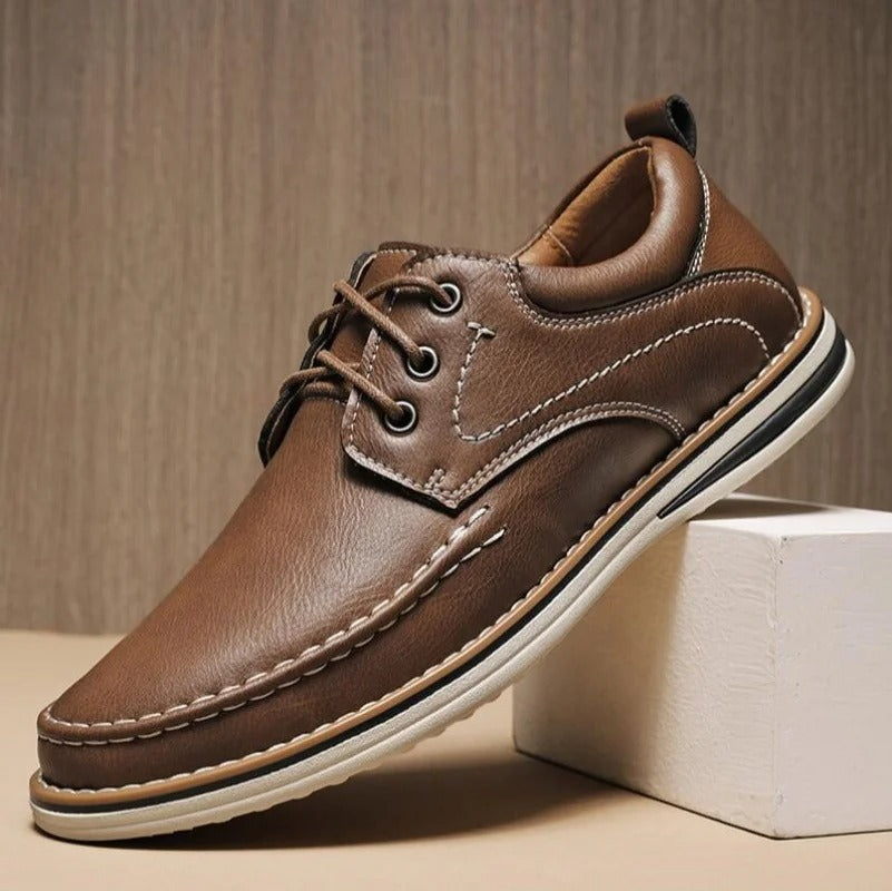 Brown leather men's moc toe oxfords, comfortable and versatile for everyday style.