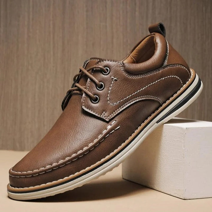 Brown leather men's moc toe oxfords, comfortable and versatile for everyday style.