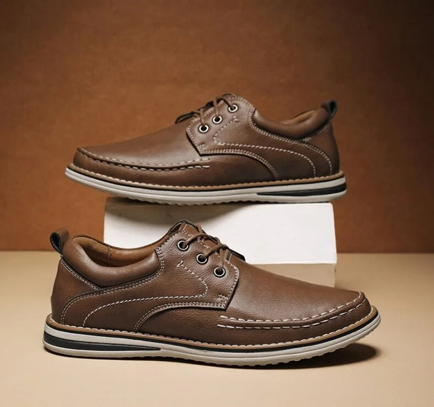Men's elegant black moc toe oxfords, ideal dress shoes for business or special events.