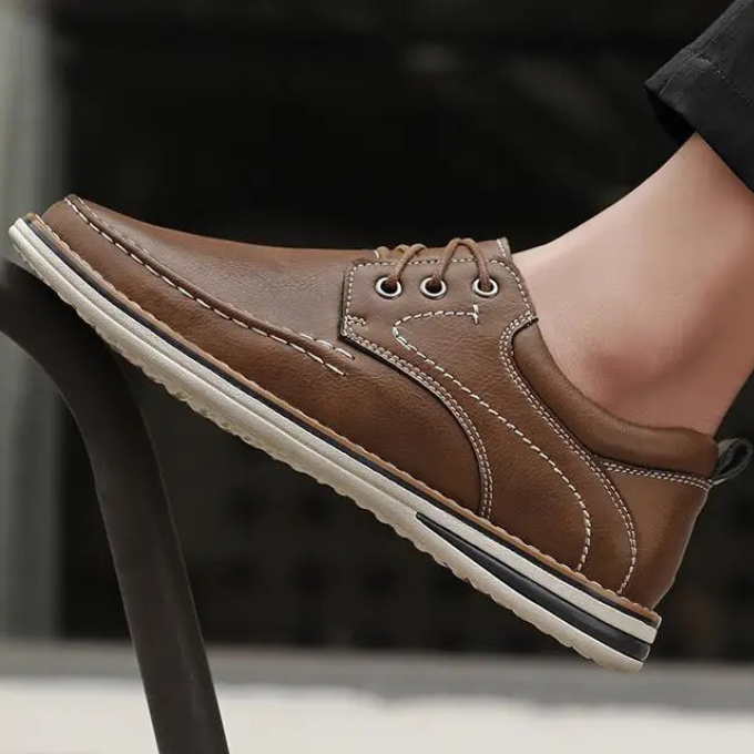 Side view of versatile men's brown leather moc toe oxford shoes, classic everyday footwear.