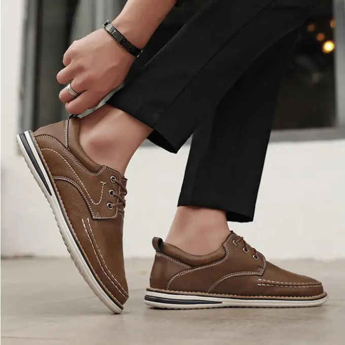 Front view of stylish men's black moc toe oxfords, offering a blend of dress and casual.