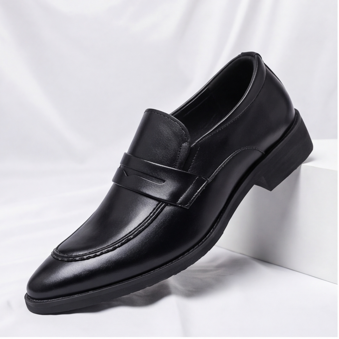 Man wearing classic brown penny loafers, showcasing stylish and comfortable everyday footwear.