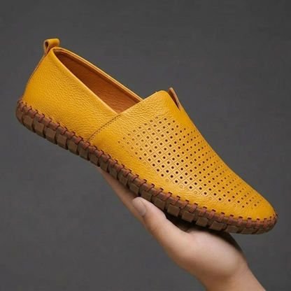 Men's fashion essential: classic perforated slip-on loafers for versatile styling.