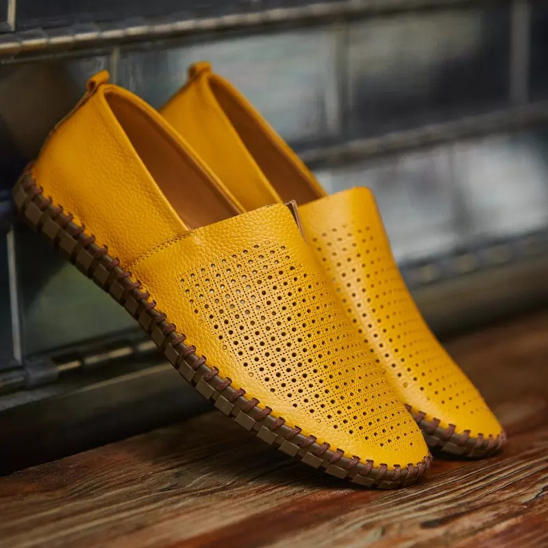 Durable men's hand-stitched loafers with unique perforated detailing.