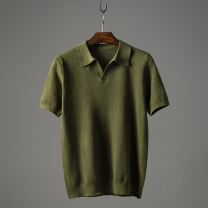 Stylish man wearing a classic short sleeve polo shirt, demonstrating its casual comfort and versatility for everyday use.