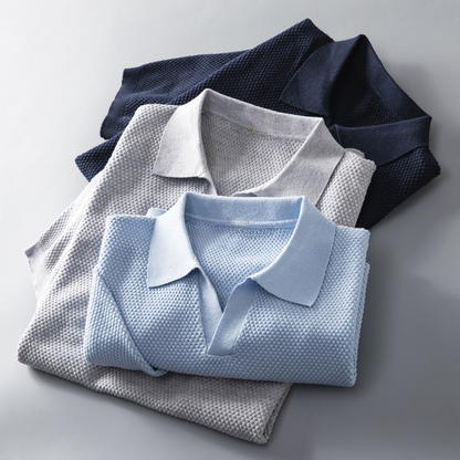 Detail of the collar and buttons on the men's classic polo shirt, highlighting its timeless design and quality.