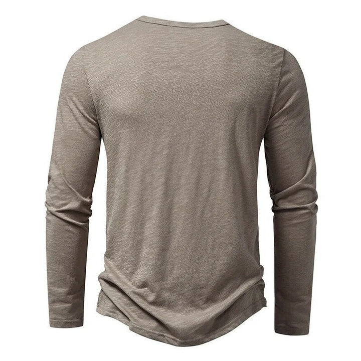 Stylish men's slim fit henley shirt, a comfortable everyday long sleeve top for men.
