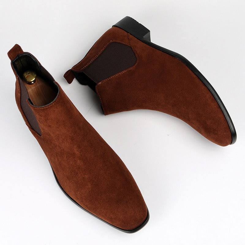Effortless men's slip-on boots featuring a sturdy wedge heel & classic Chelsea design.