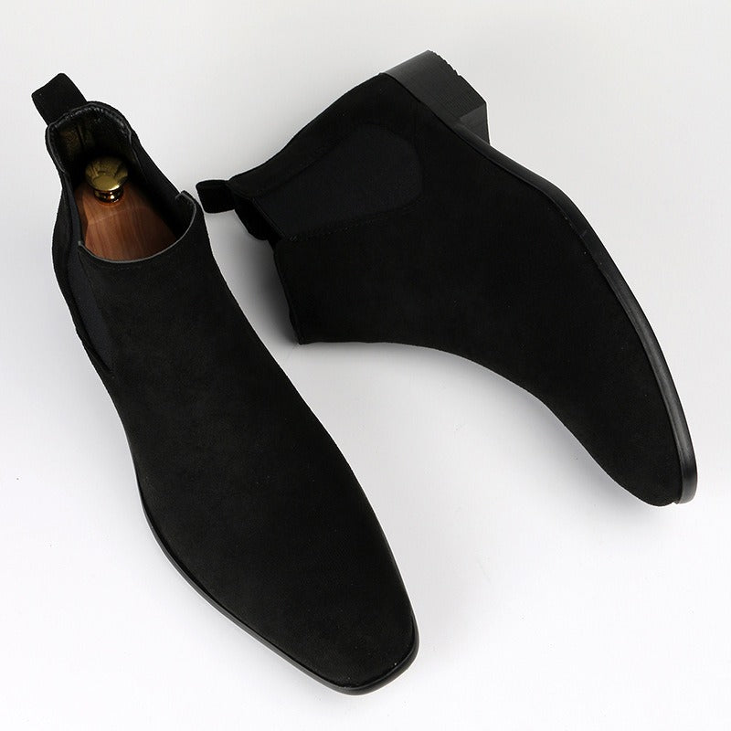 Men's black Chelsea boots for casual footwear, offering easy slip-on convenience.