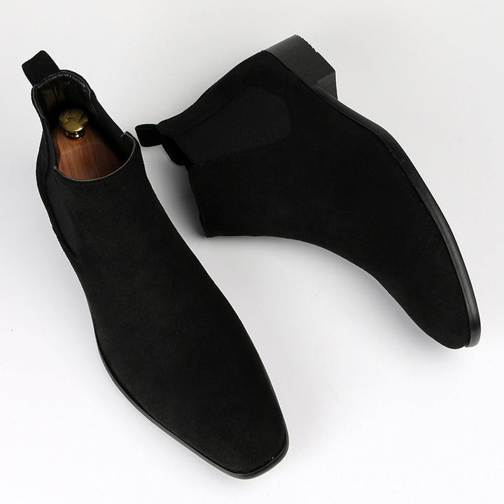 Men's black Chelsea boots for casual footwear, offering easy slip-on convenience.